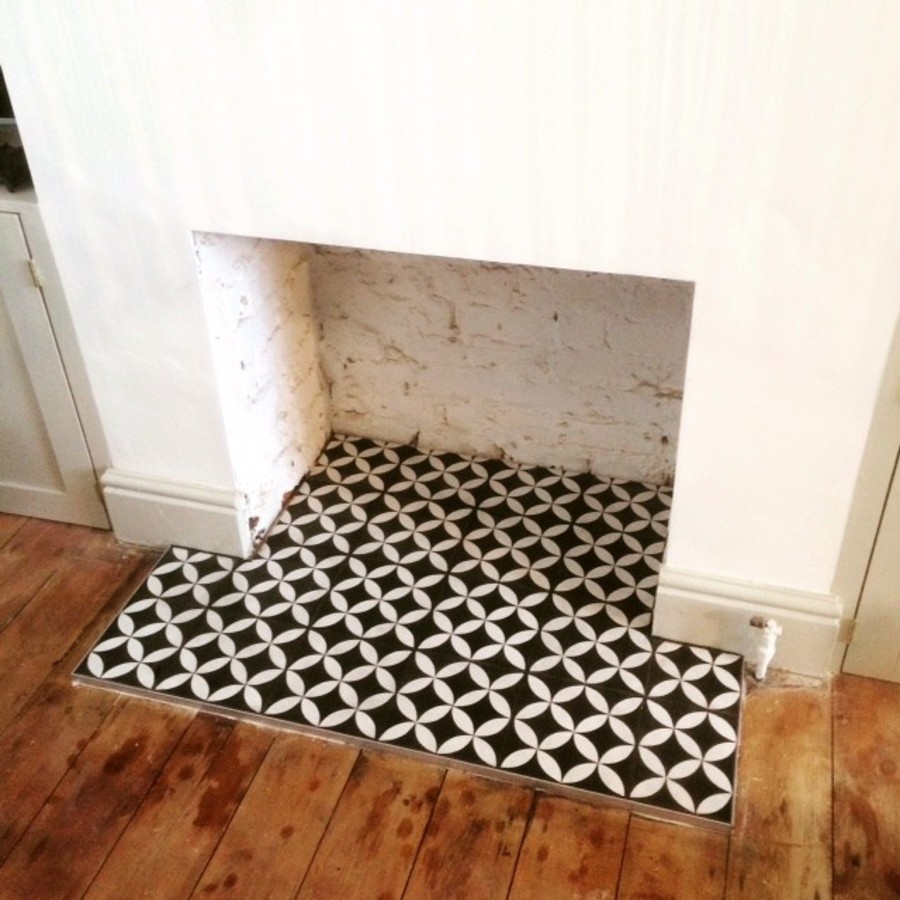 black and white tiles in fireplace